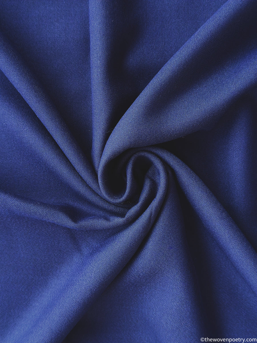 Close-up of Black navy blue with a swirl pattern by Woven Poetry