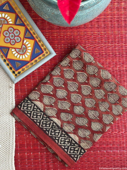 Folded view of Bagru hand block printed Kota Doria suit in Rust set by Woven Poetry
