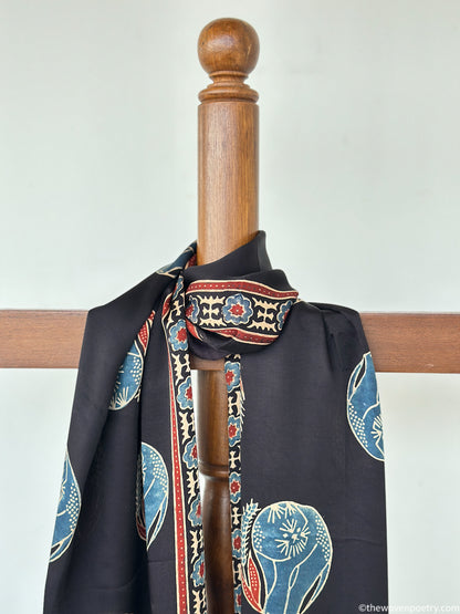 Black modal silk Ajrakh border stole handcrafted by Woven Poetry