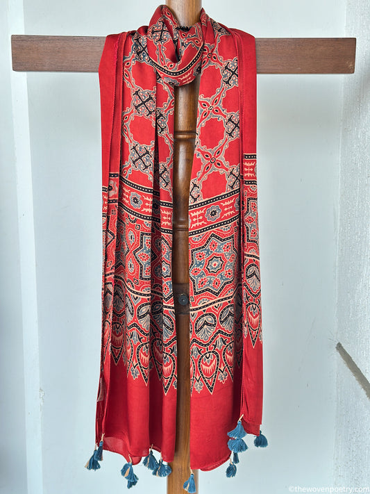 Handcrafted red modal silk Ajrakh  stole  with tassels by Woven Poetry