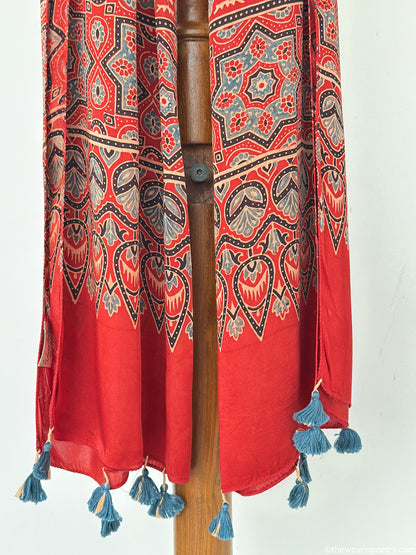 Handcrafted red modal silk Ajrakh  stole  with tassels by Woven Poetry