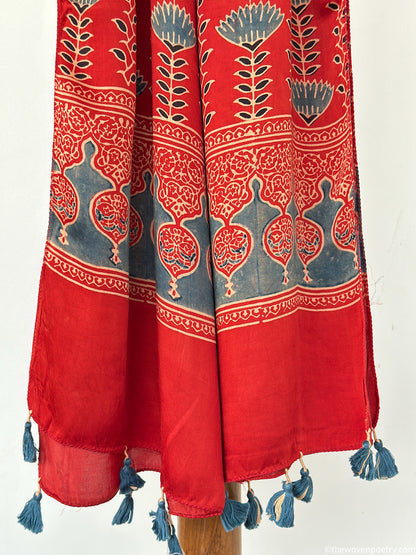Handcrafted  red Ajrakh floral stole with blue and ivory border detailing by Woven Poetry