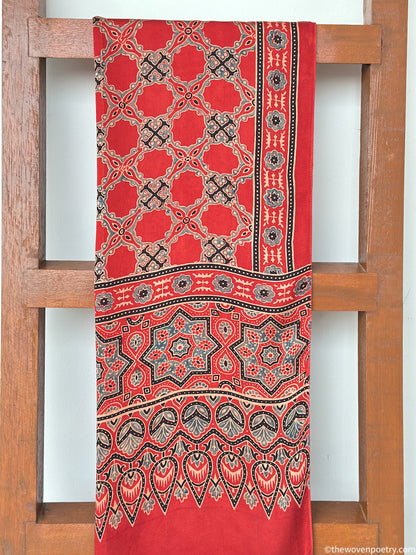 Handcrafted red modal silk Ajrakh  stole  with tassels by Woven Poetry