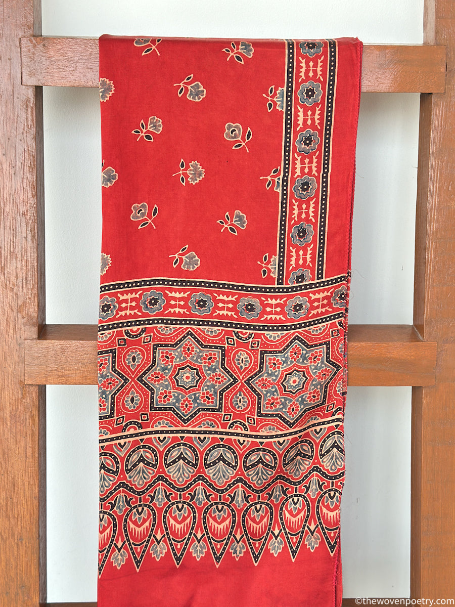 Soft modal silk handcrafted stole in red with traditional Ajrakh inspired print and smooth texture