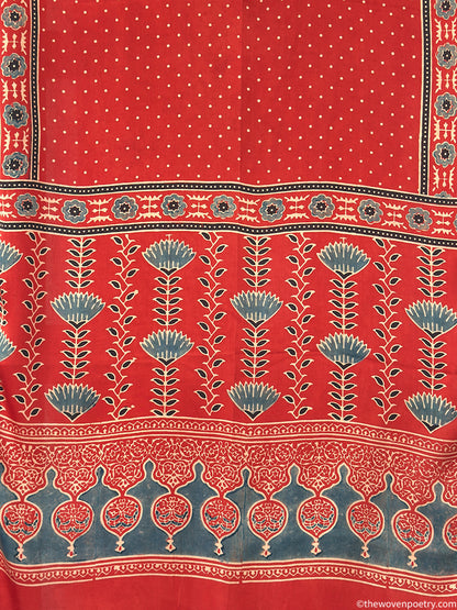 Handcrafted  red Ajrakh floral stole with blue and ivory border detailing by Woven Poetry